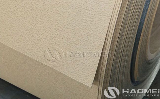 Aluminum stucco embossed with polykraft moisture barrier